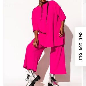 Dressed in LALA bright pink playsuit